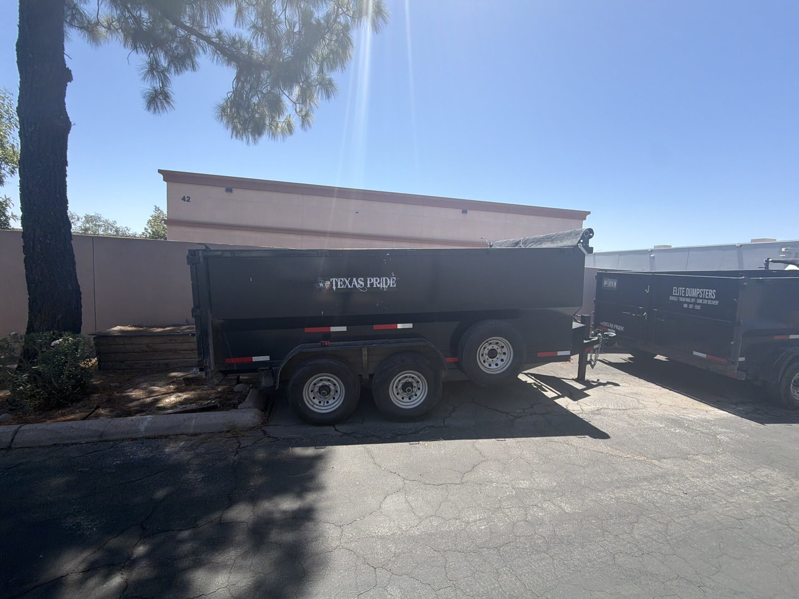 Toss It dump trailer staged in a parking lot