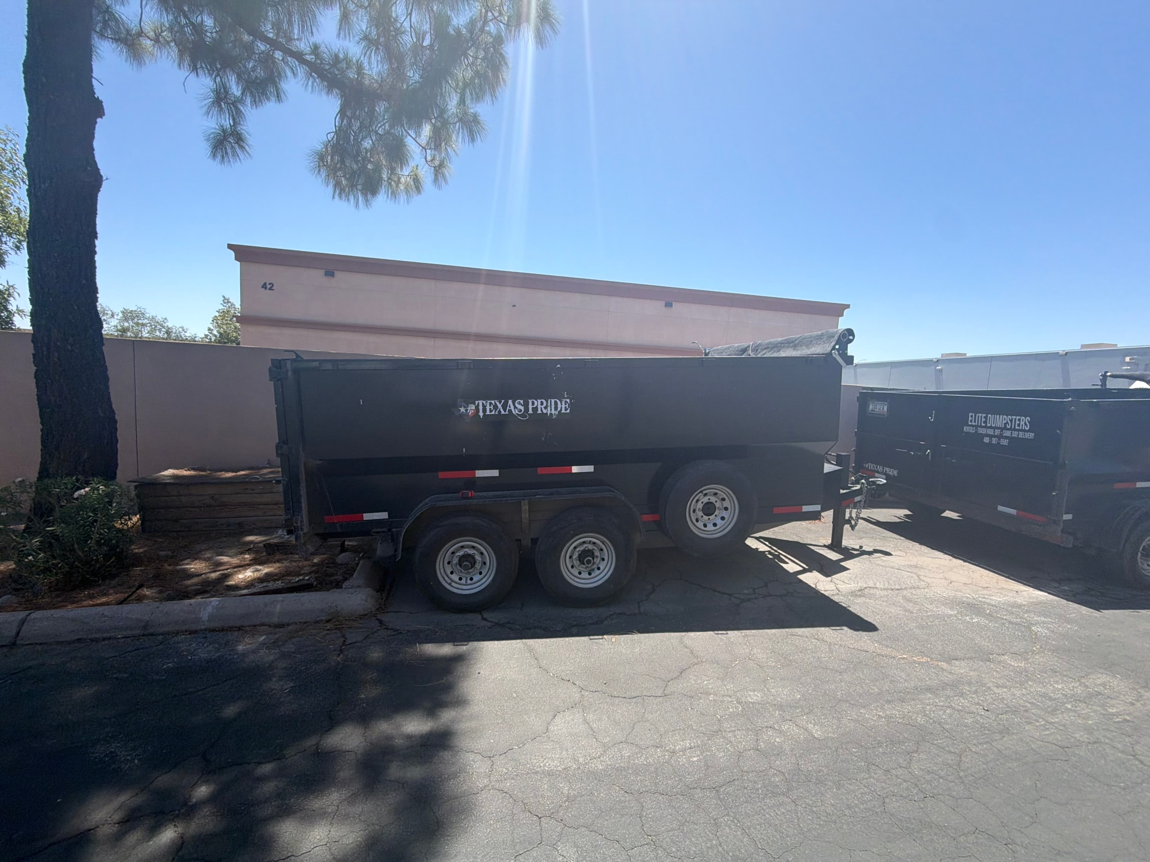 Toss It dump trailer staged in a parking lot
